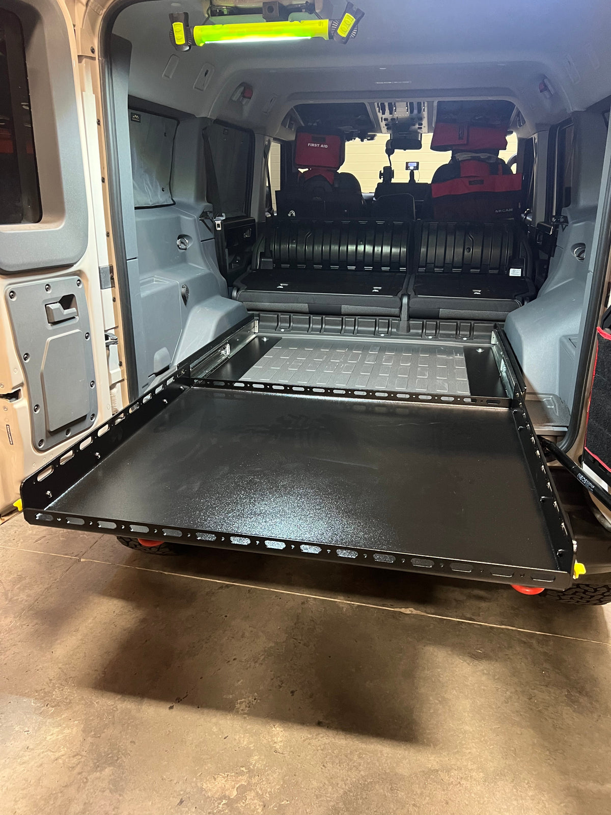 Grenadier slide floor fully extended out the rear doors
