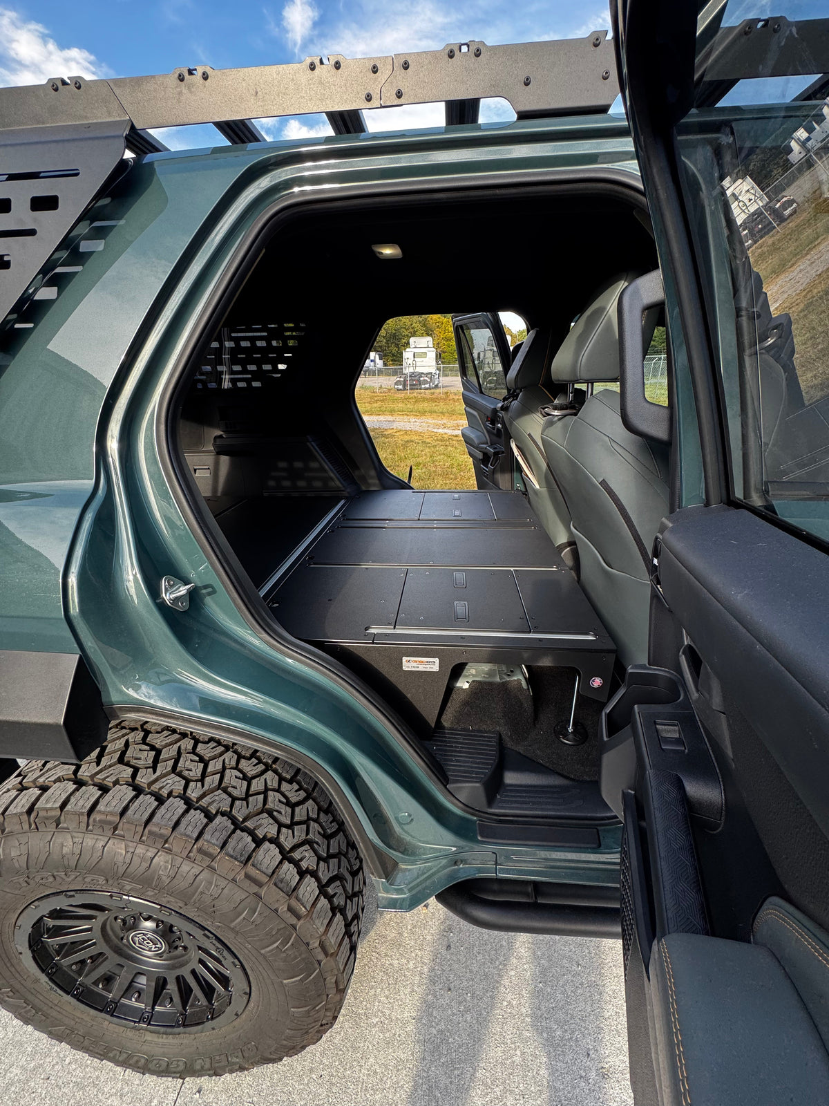CargoKits Base Plate System installed in a 4Runner Hybrid, real install photo showing panel seams and tie-down track