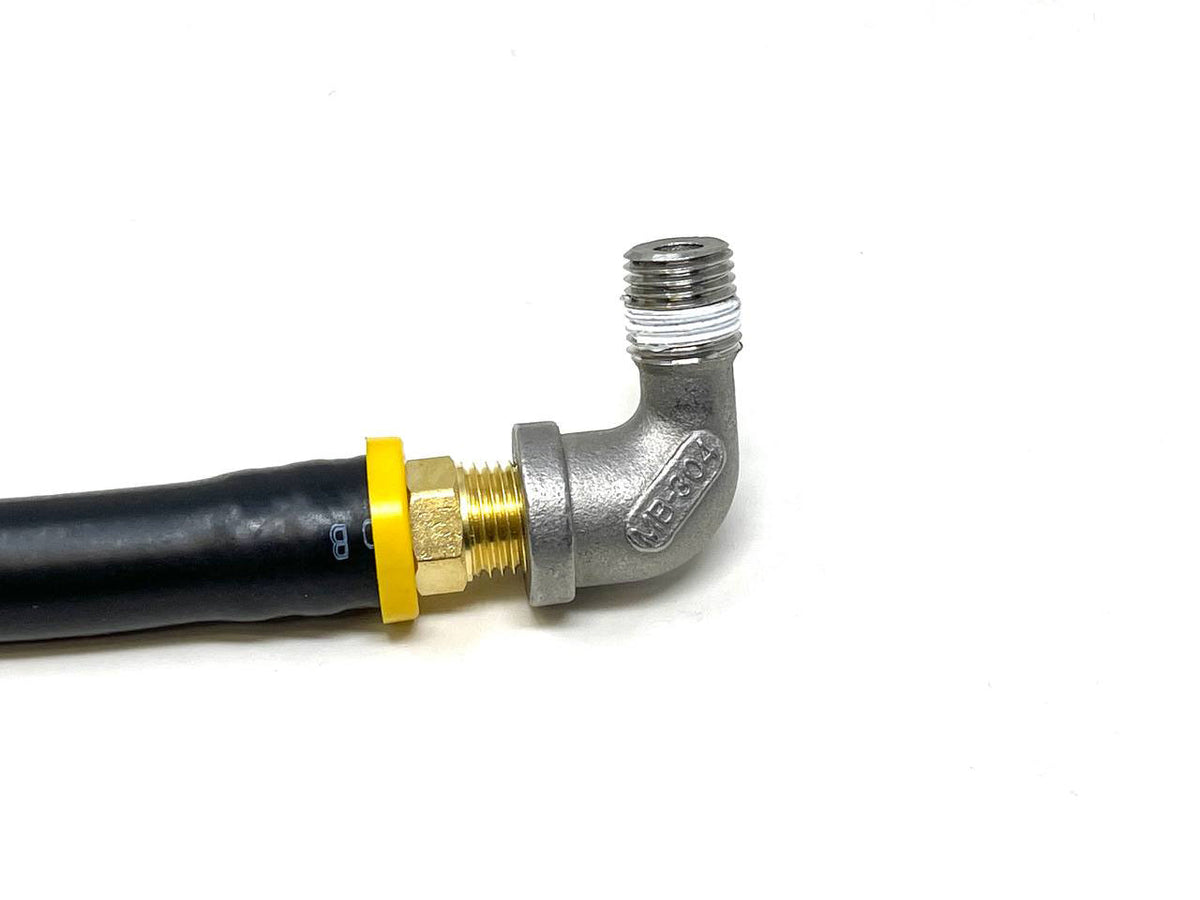 Black hose with a brass 90-degree elbow fitting