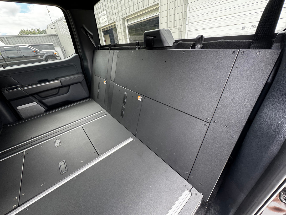 CargoKits Rear Seat Delete in a Ford F-Series SuperCrew, view of the platform installed alongside the folded rear seat frame