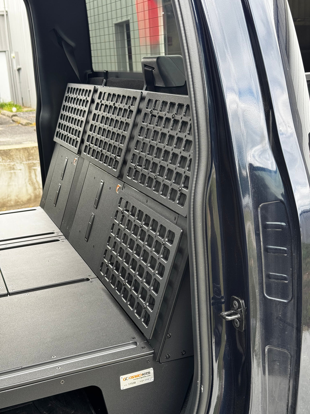 CargoKits Universal Molle Panels installed on both side walls of a Ford F-Series SuperCrew's rear cab