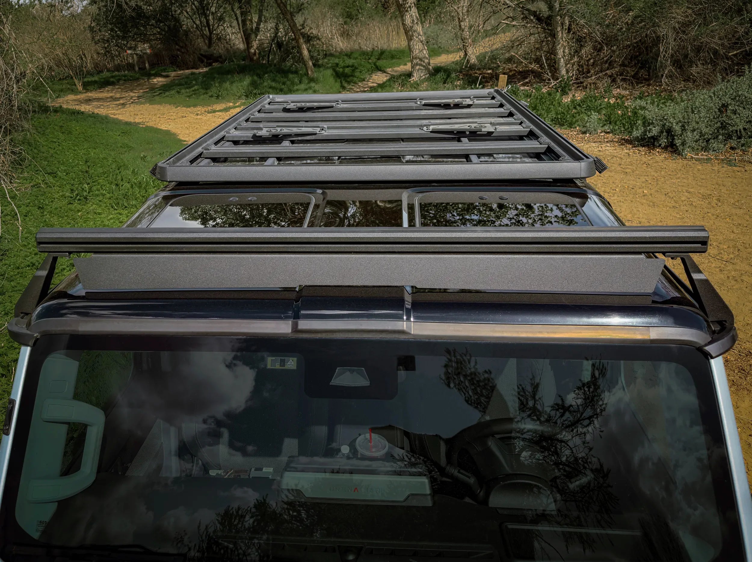 OVERHEAD VIEW OF 3/4 GRENADIER ROOF RACK AND FRONT LOAD BAR ON GRENADIER OUTSIDE