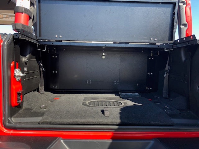 Open tailgate on a red JL showing the Slipstream wall and raised folding top