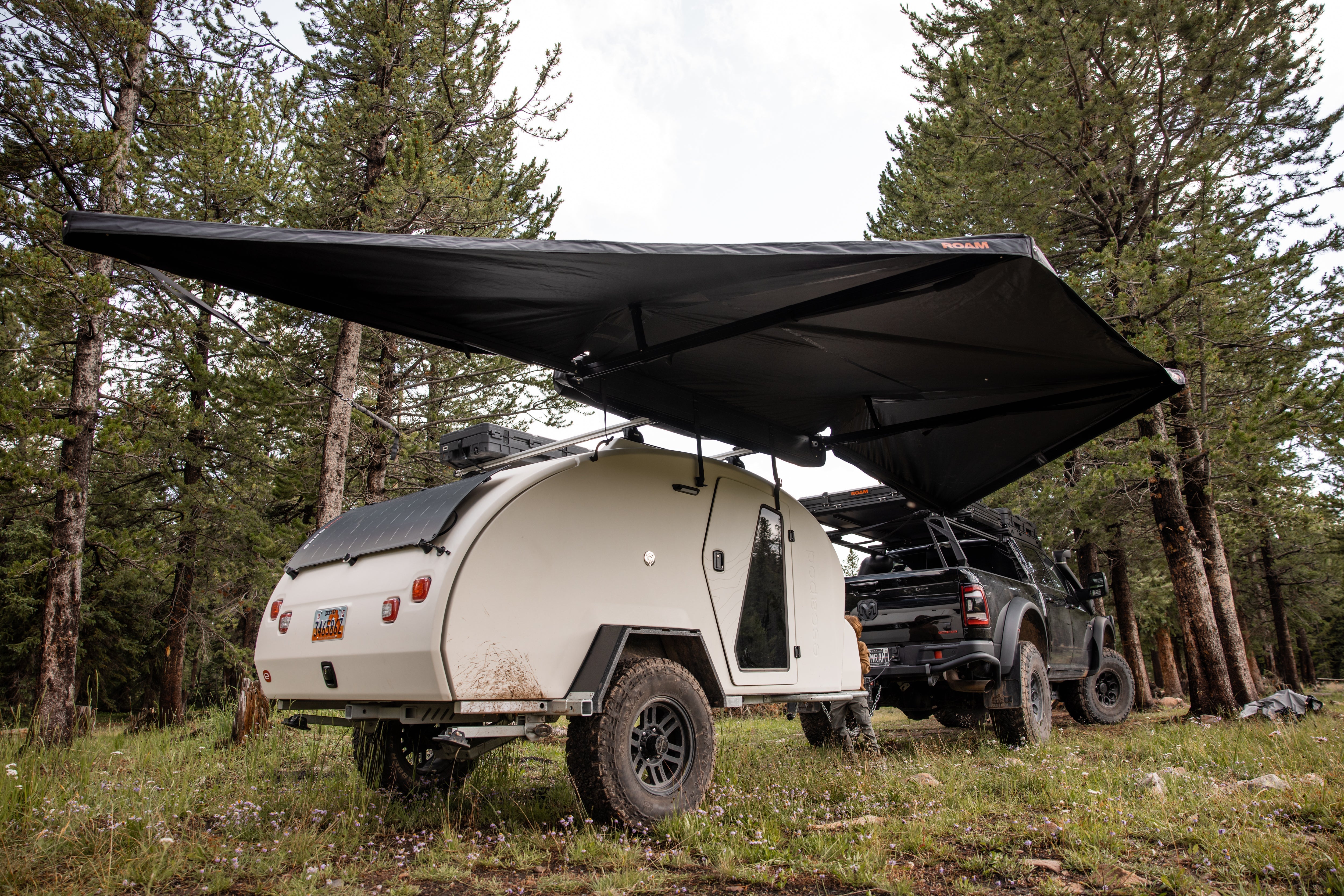 ROAM ARC 180 awning providing shade at camp