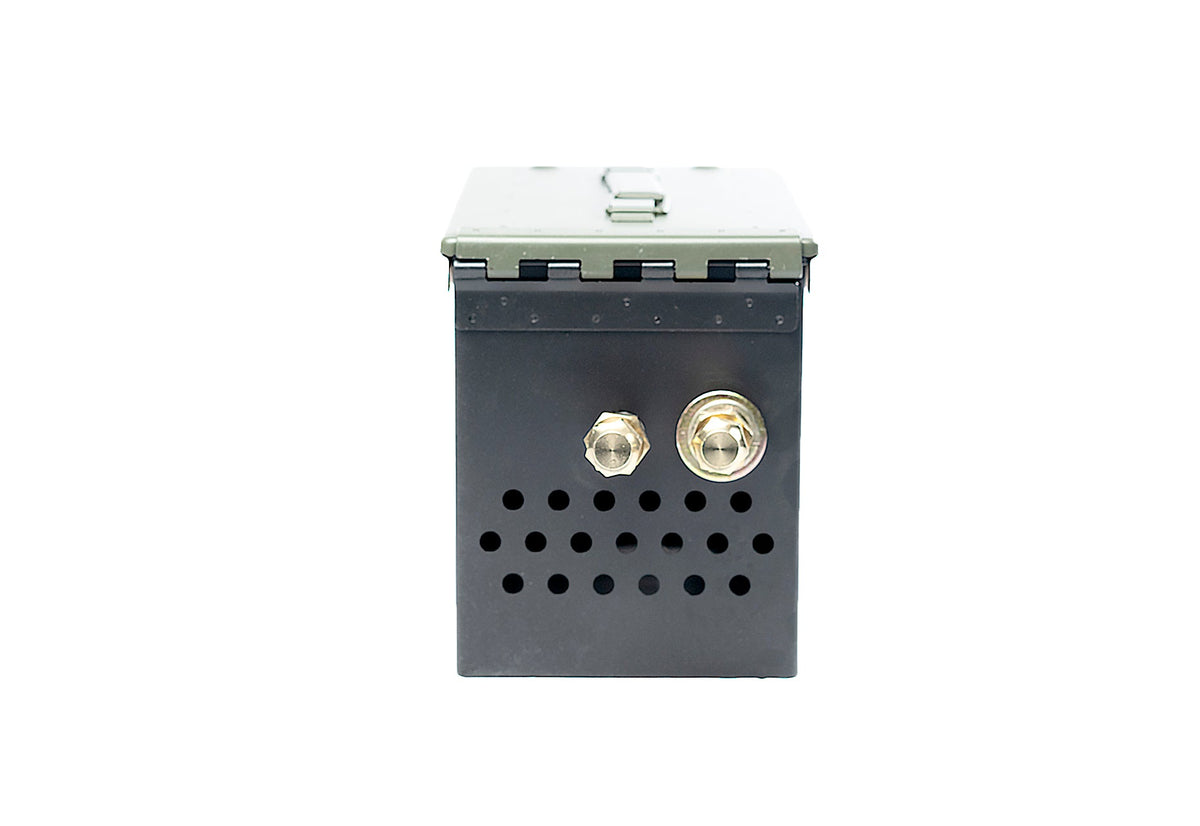 Olive green ammo-can-style firebox with dual brass burner valves and perforated vents, studio shot on white background