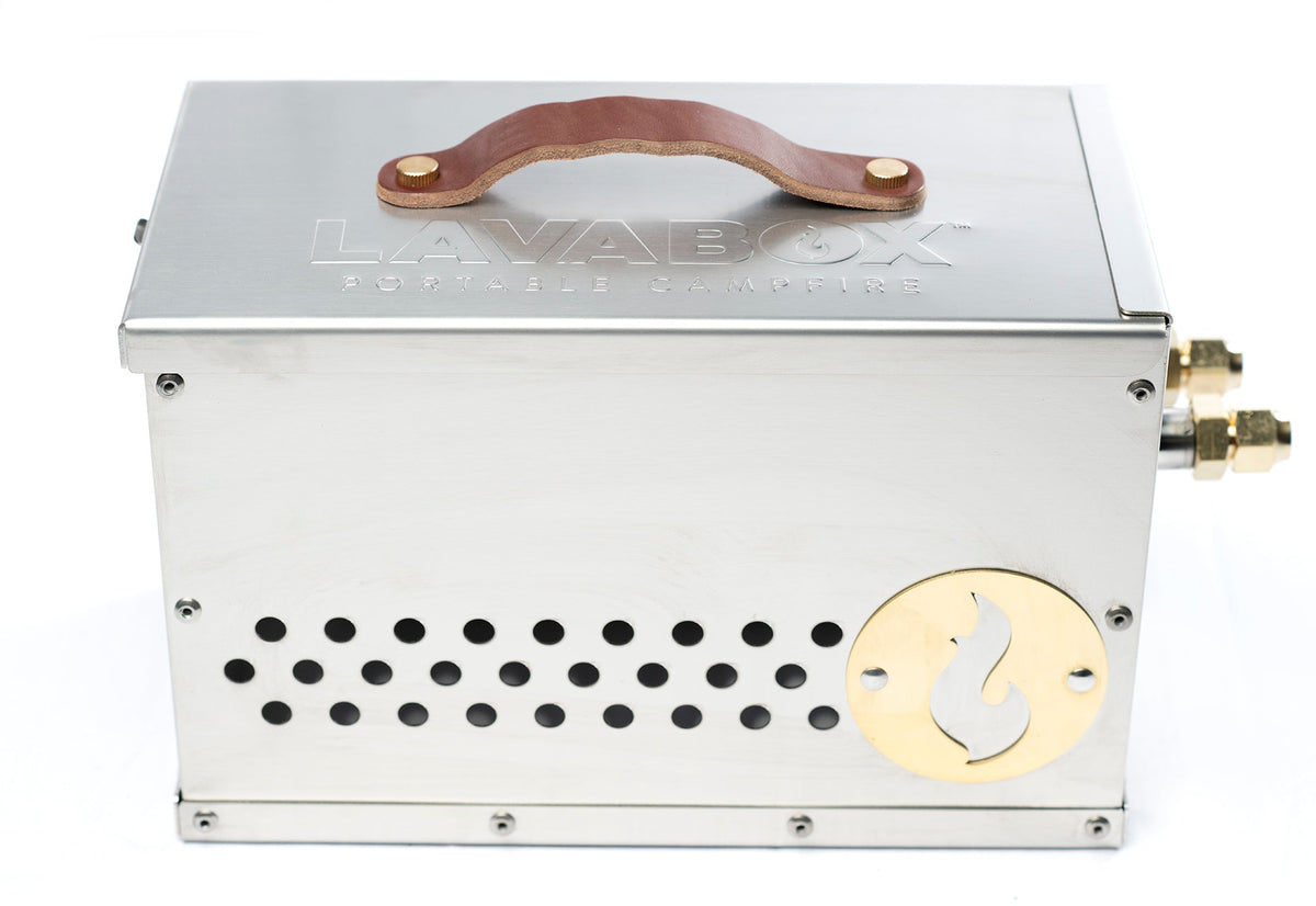 Stainless steel firebox with leather carry handle and perforated side vents, studio shot on white background