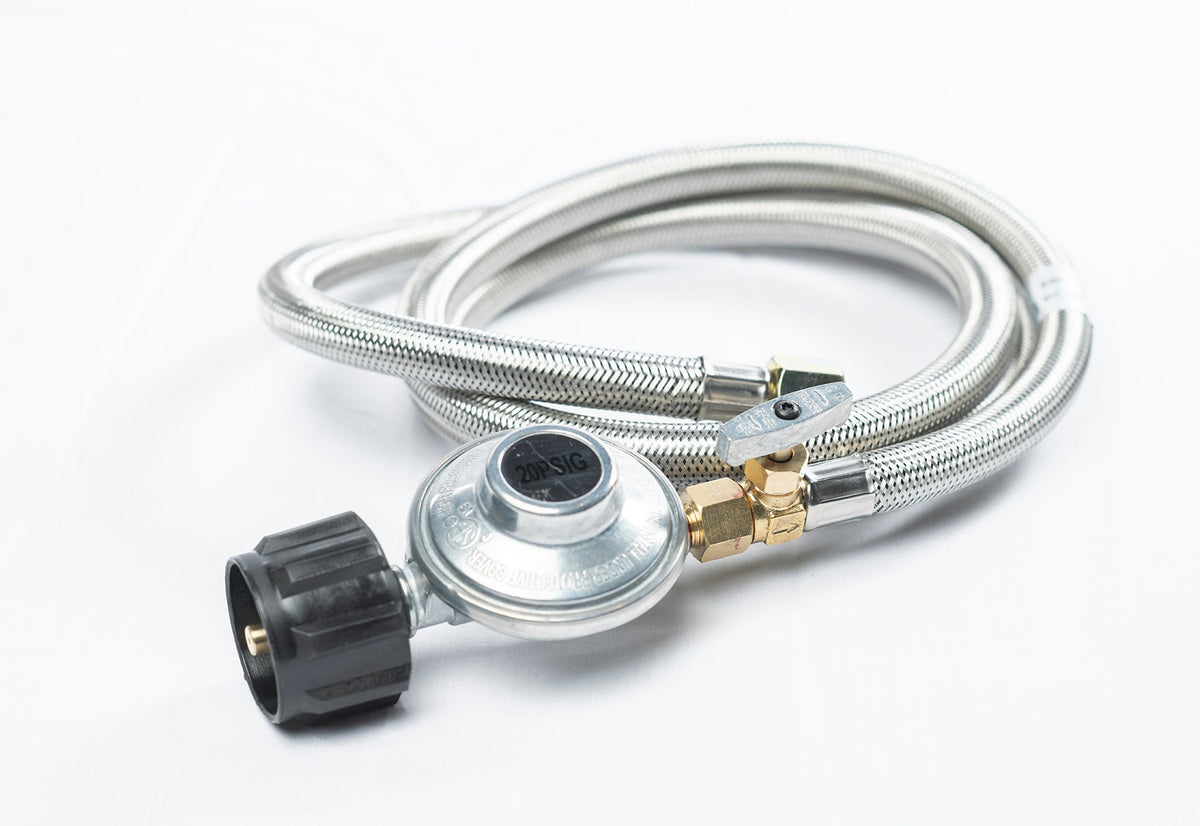 Stainless steel braided propane hose coiled with regulator, studio shot on white background