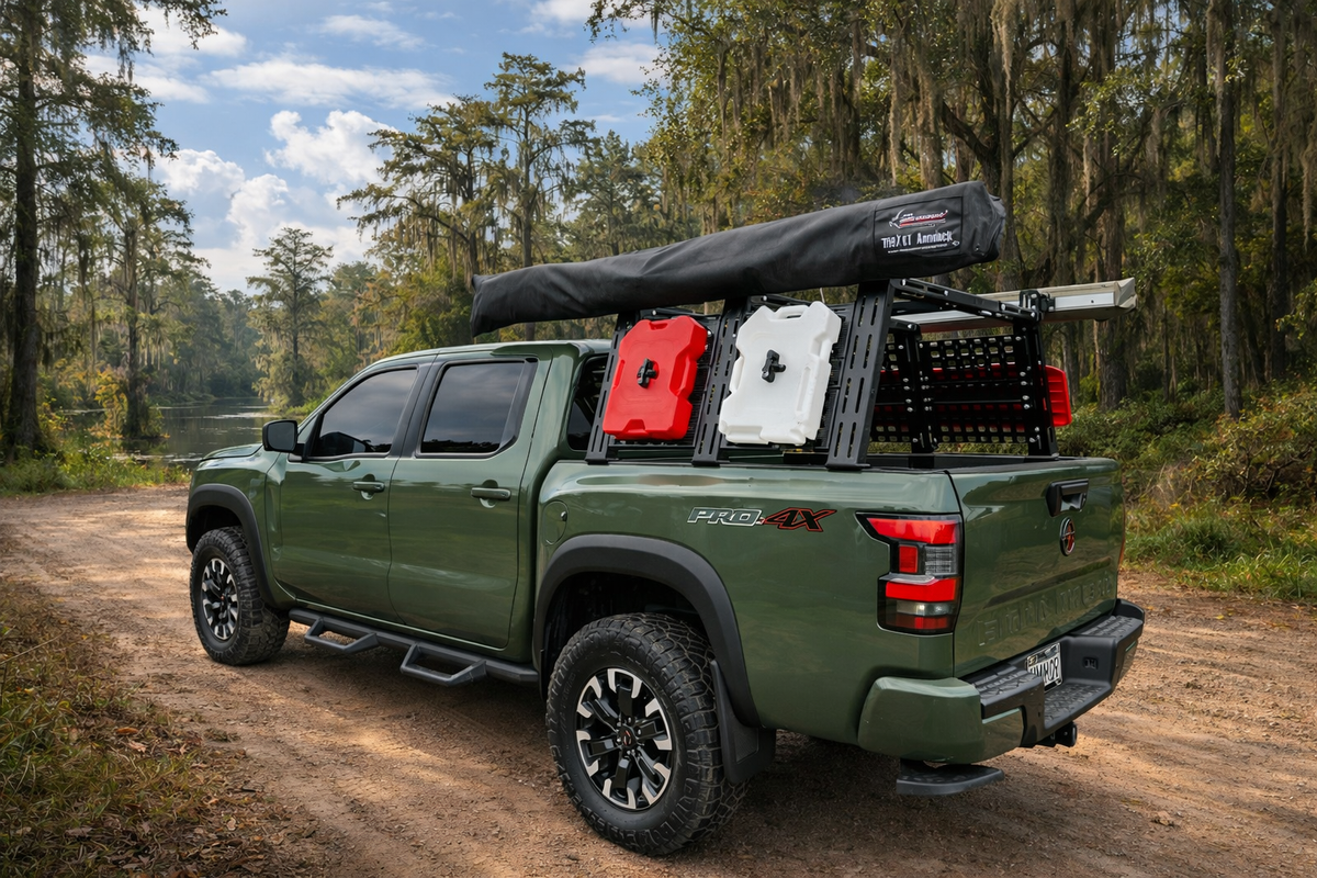 Green Frontier with ROCK-IT rack, red and white cans and tent on a forest trail