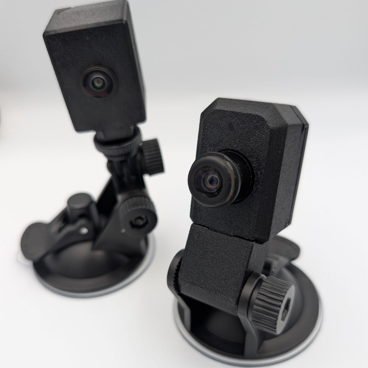 Two GG Offroad suction cup mounts with factory Toyota cameras installed