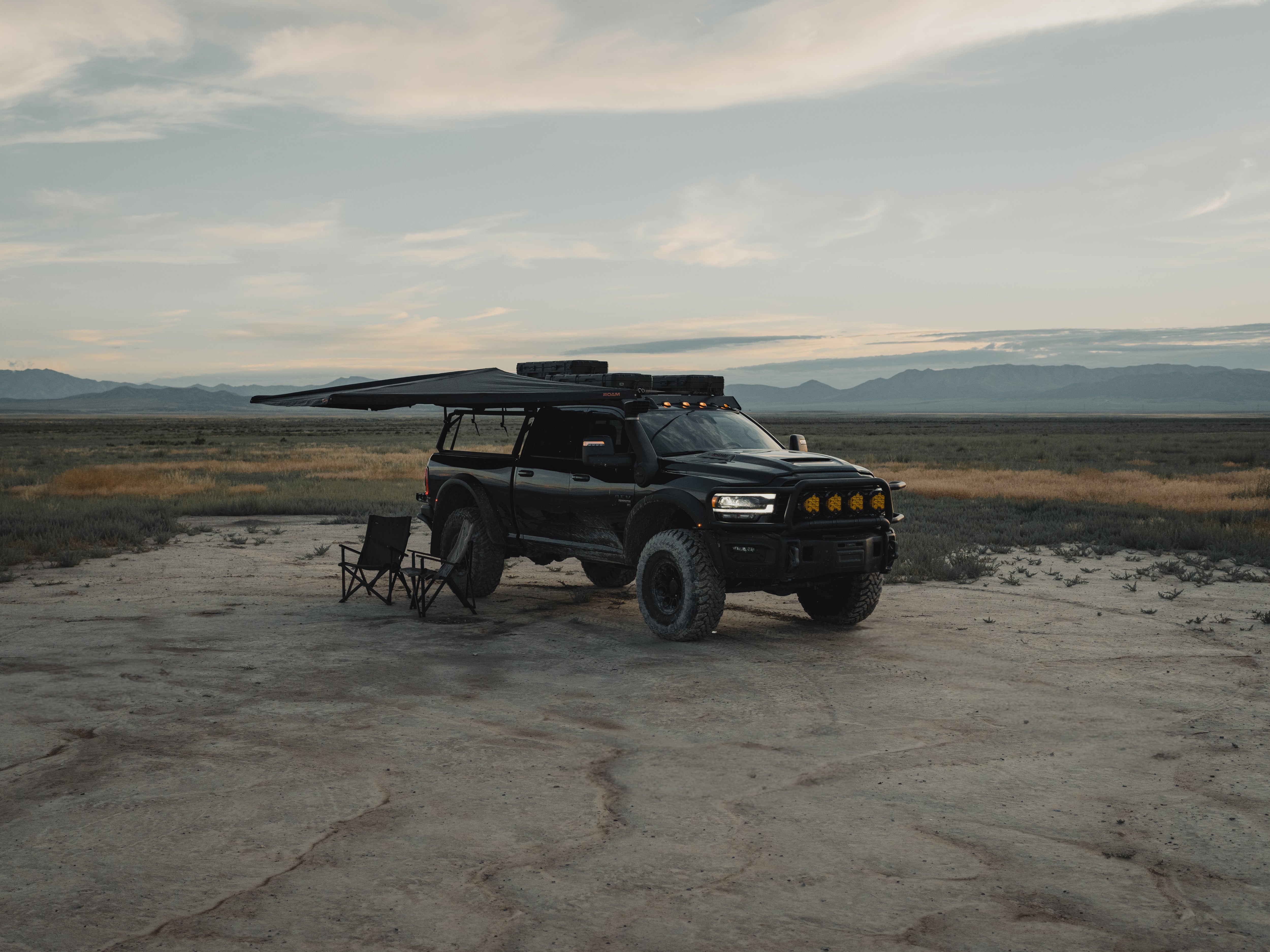 ROAM ARC 180 awning shading an outdoor camp setup