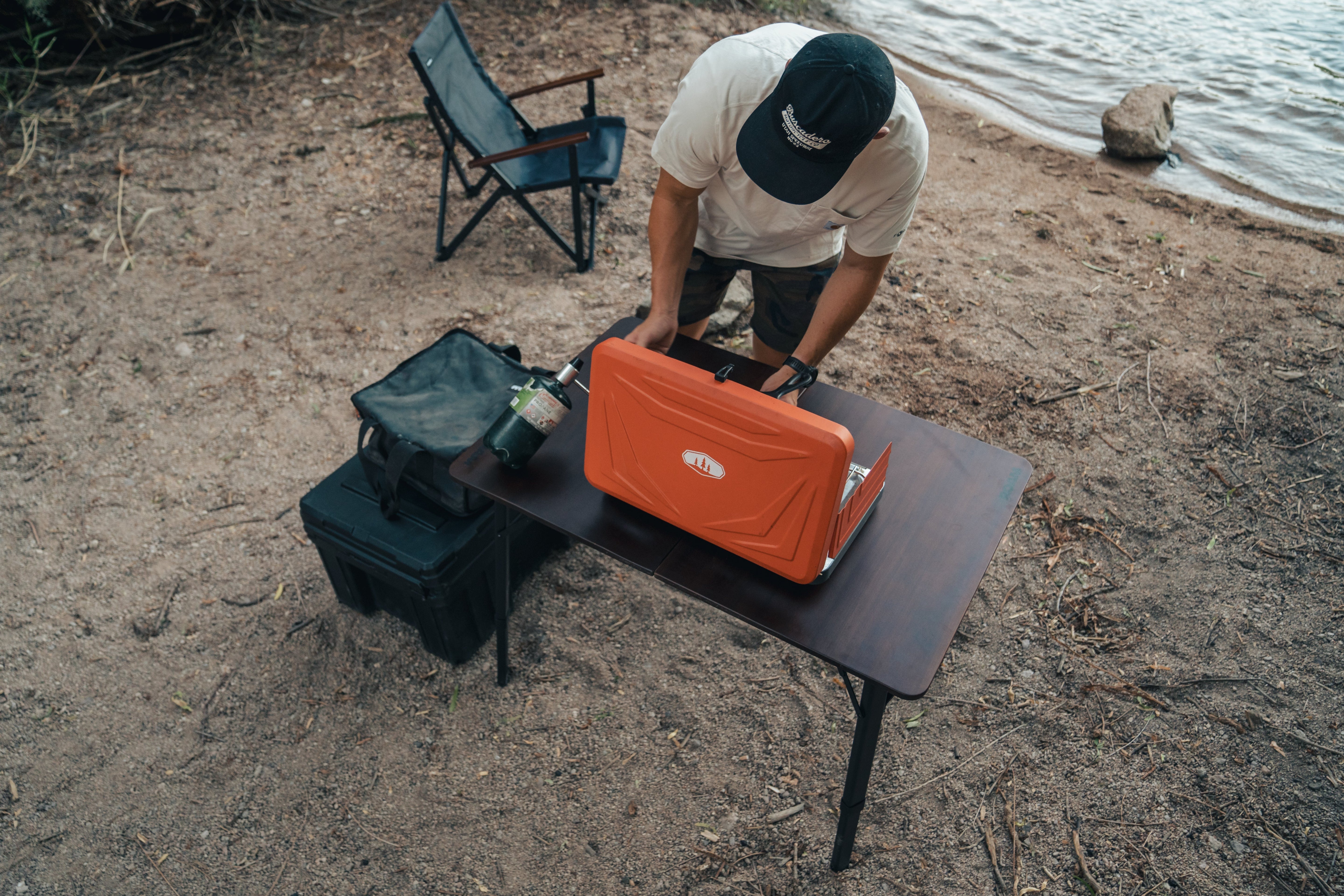 ROAM camp table with gear on top outdoors
