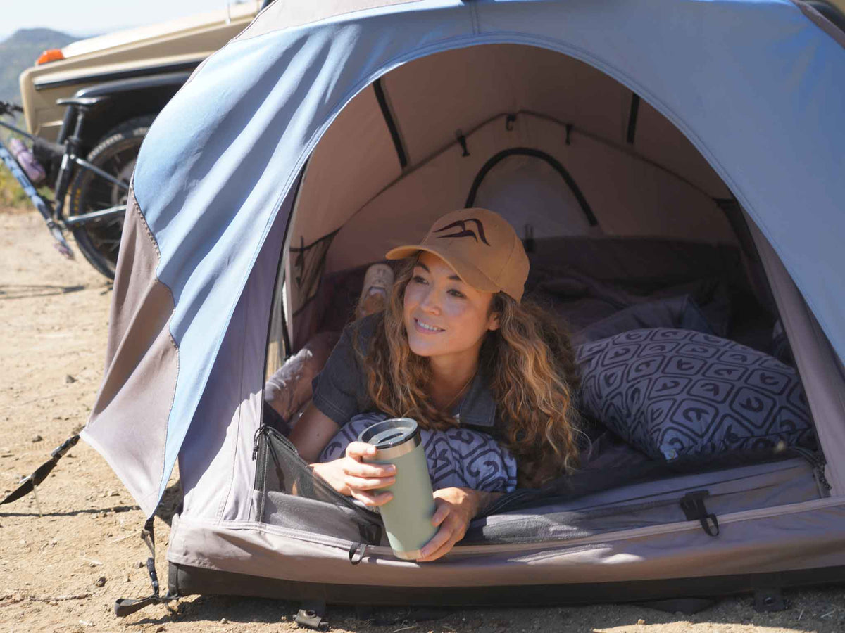 C6 Rev Rooftop Tent X (Element) – people relaxing at a camp with a ground tent