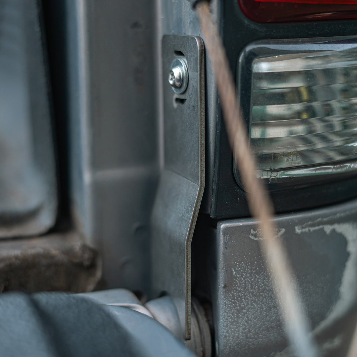 Close view of the security bolt on the installed tailgate theft protector
