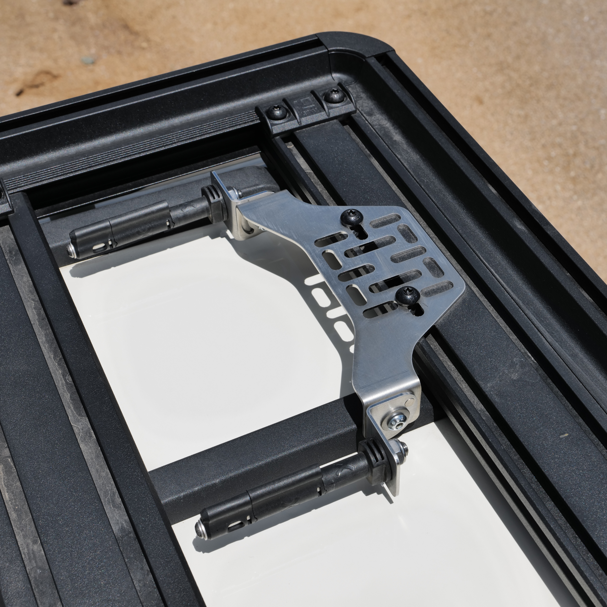 Stealth Folding Mount with Maxtrax Pins attached, Showing pins flat on a roof rack