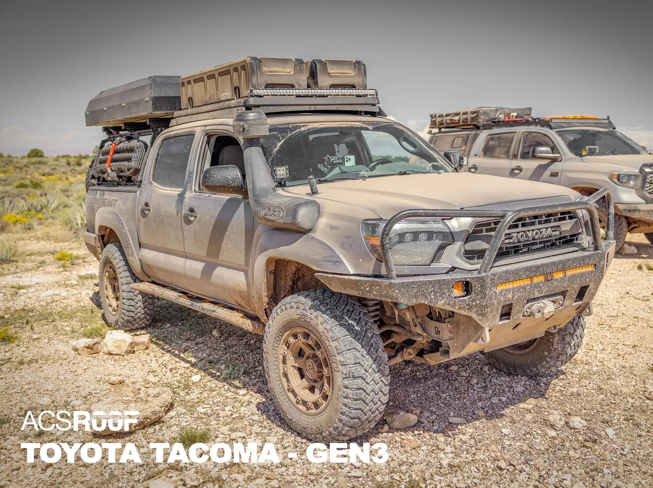 OUTSIDE PICTURE OF OFF ROAD TOYOTA TACOMA WITH ACS OVER CAB ROOF RACK