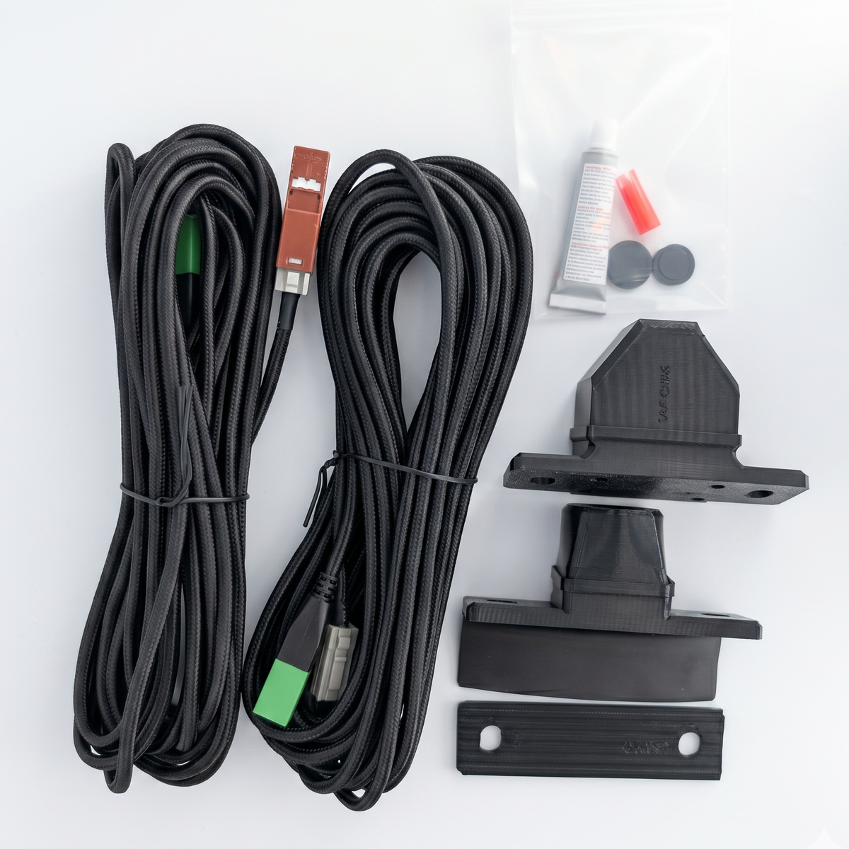 GG Offroad Tacoma 4th Gen camera relocation kit with two braided cables and external camera housings