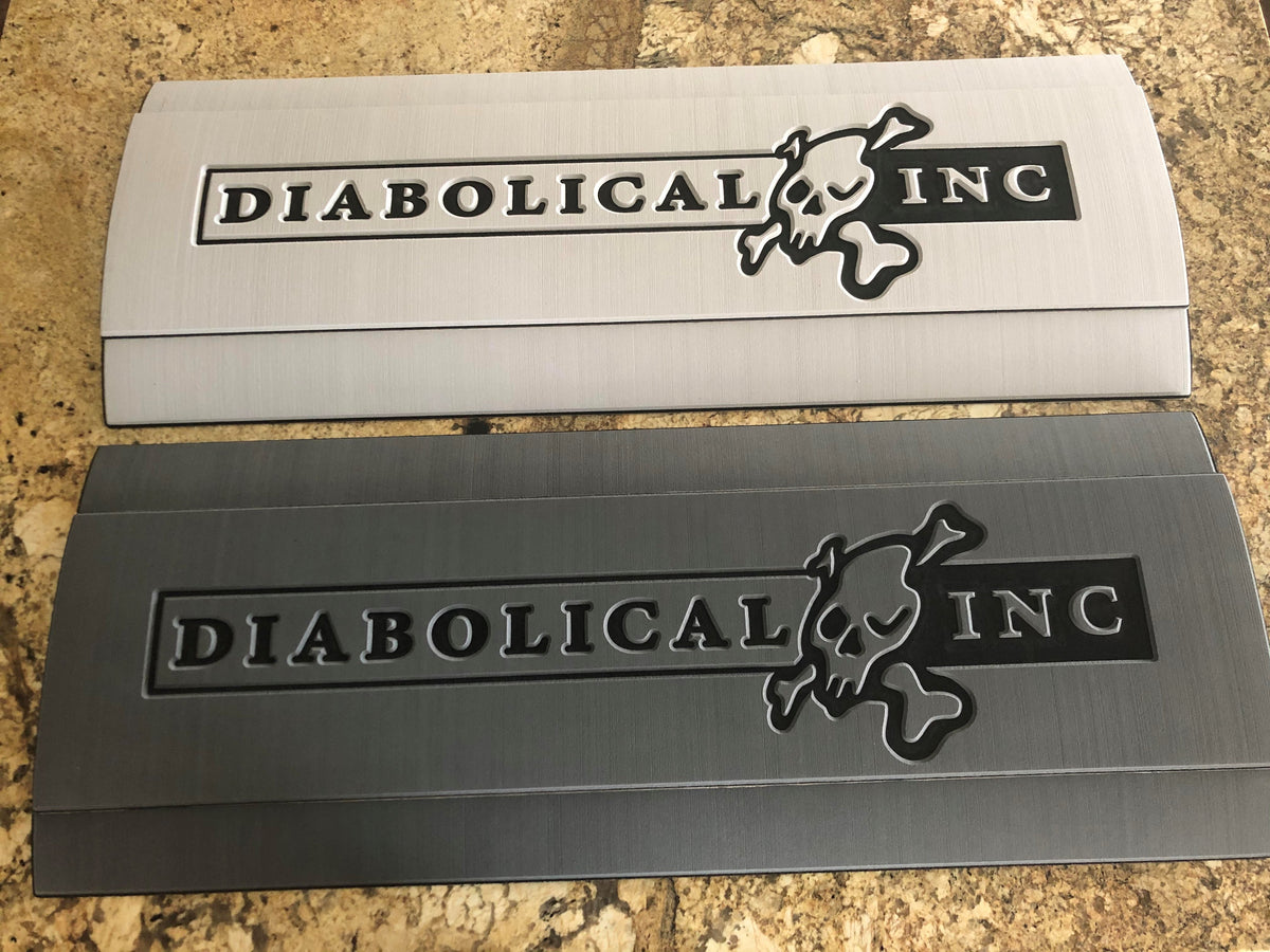 Light and dark gray foam pads with the engraved Diabolical Inc logo