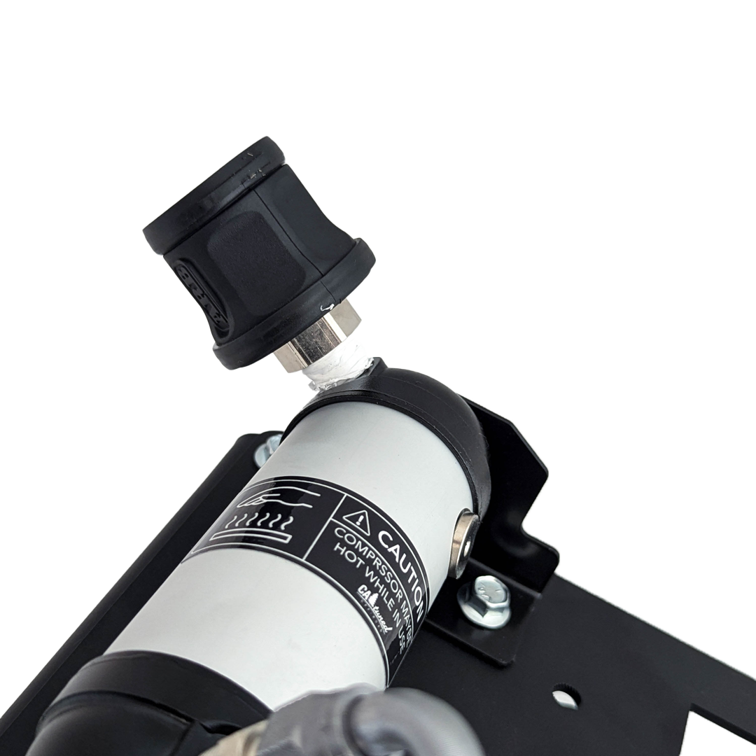 Close view of the air tank fitting and label on the mount