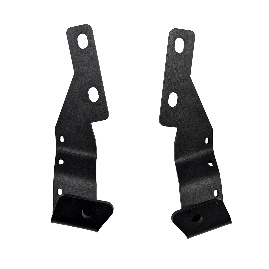 Pair of black ditch light brackets standing upright on a black background