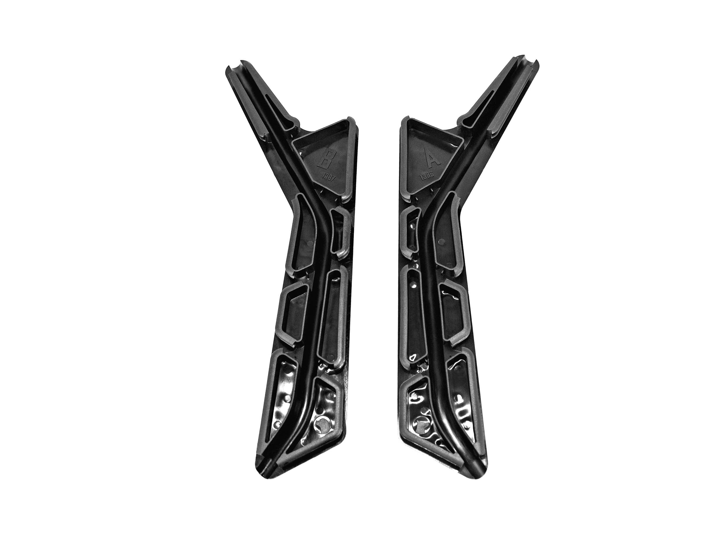 UNDERSIDE OF TWO BLACK PLASTIC CAPS FOR WIRES