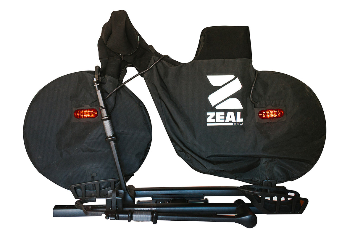 ZEAL Pro mountain bike cover zipped closed on a tray hitch rack with the Light Kit tail lights fitted, front view