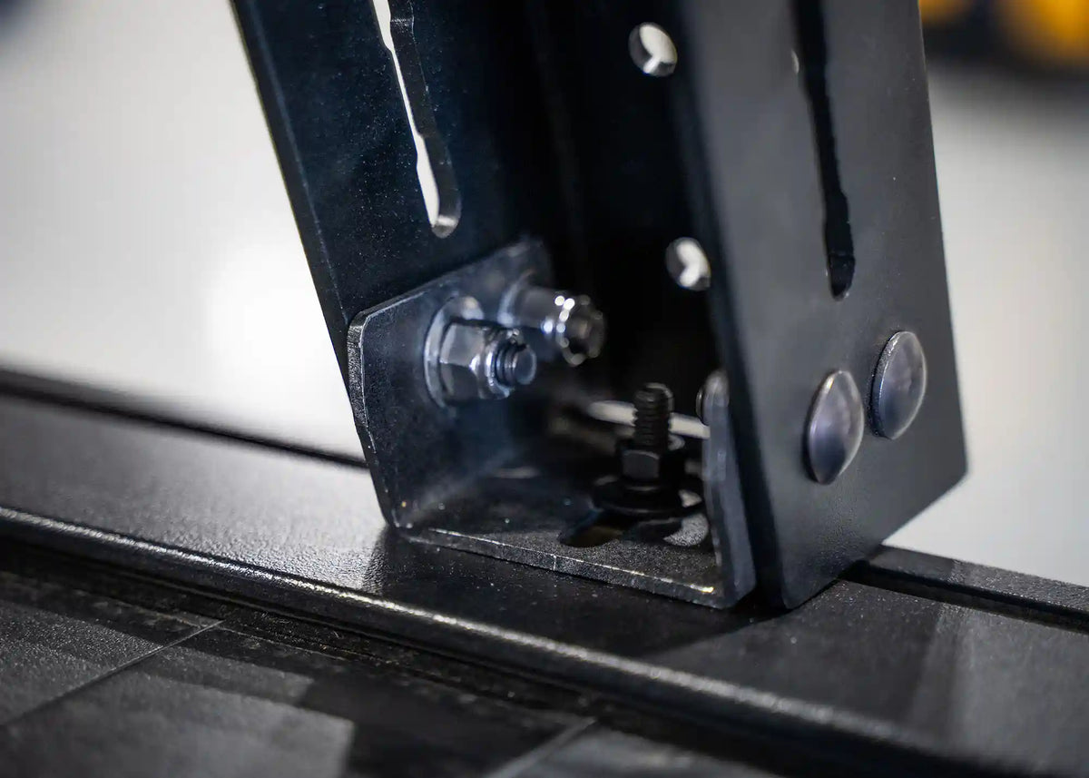 Bed rack mount bracket for retractable bed covers, close-up view