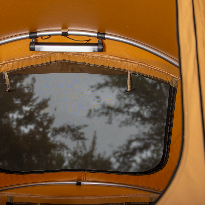 ARB tent light illuminating a rooftop tent interior