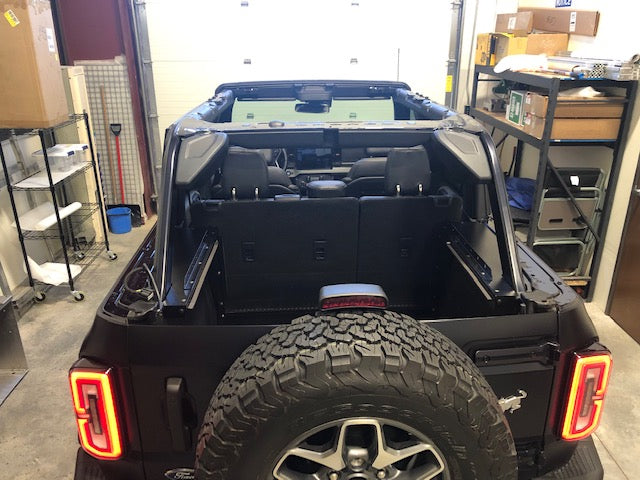 Rear of a black Bronco 4-door in a shop with the Slipstream installed