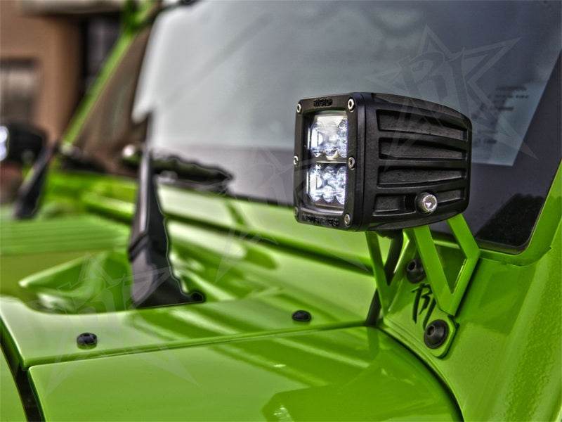 Rigid Industries JK A-pillar mount holding Rigid D-Series pod lights