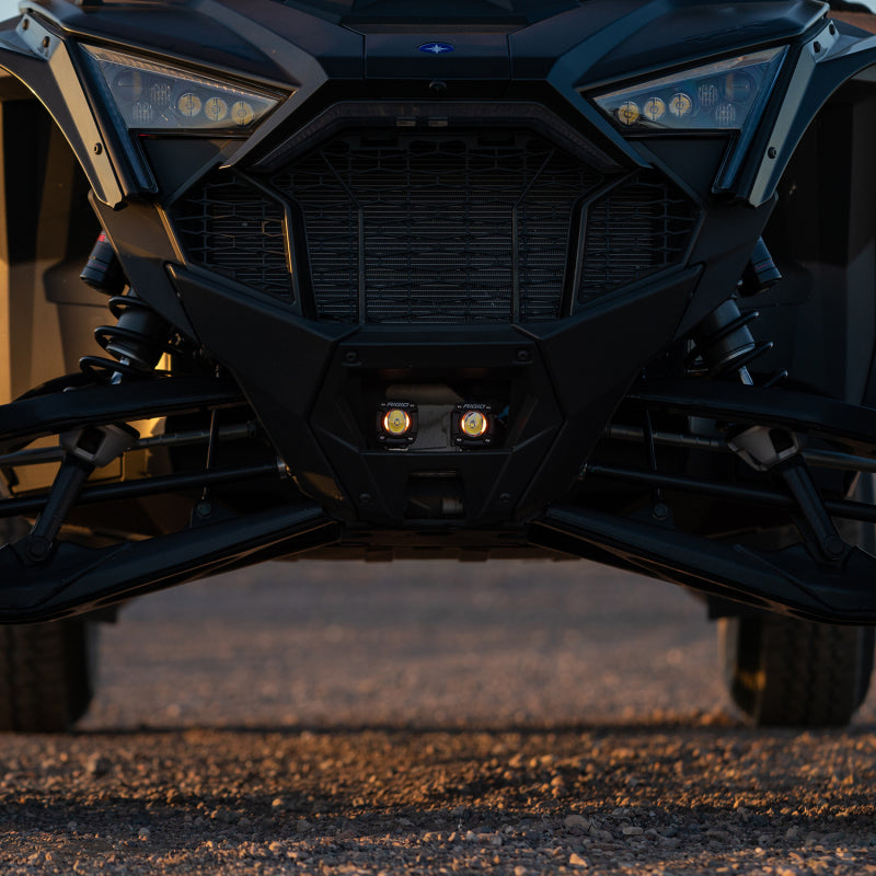 Rigid Revolve pods mounted in the Polaris RZR Pro R grille