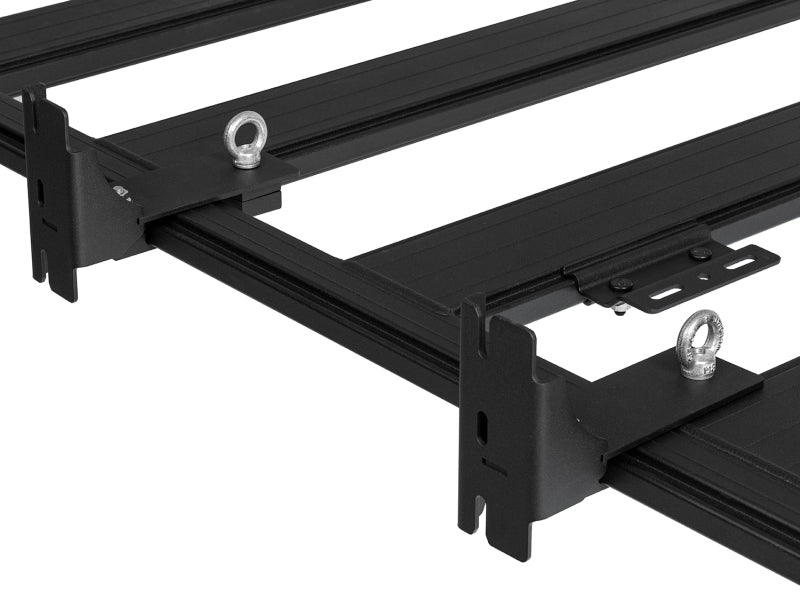 Close-up of ARB awning bracket quick-release slots and eye-nut tie-down points