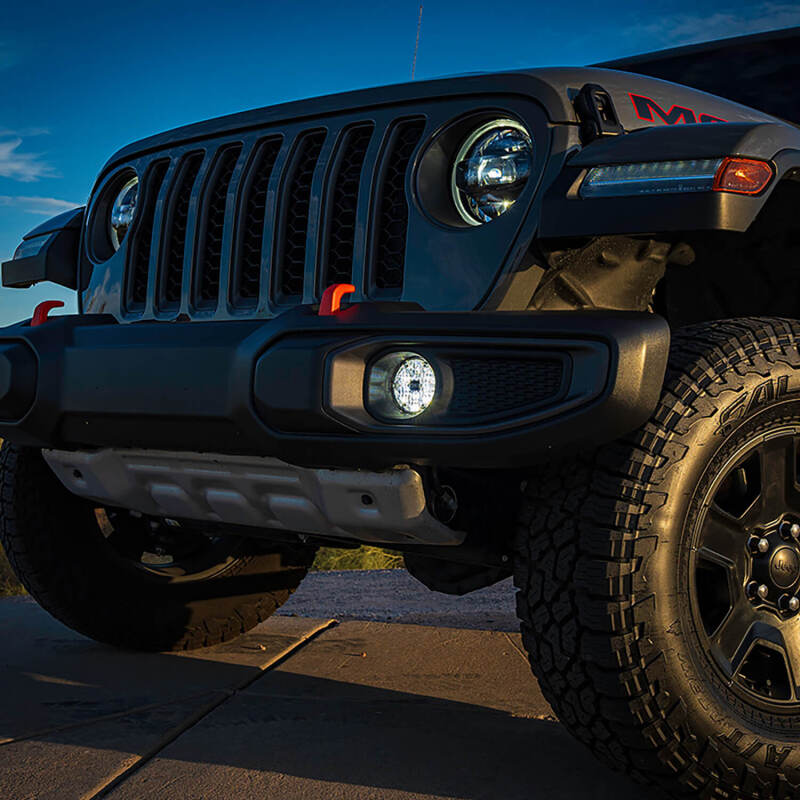 ARB Quatro SAE white fog light installed in Jeep three-piece plastic bumper