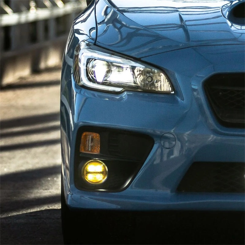 Rigid 360-Series PRO yellow fog light mounted in Subaru OEM fog lamp location