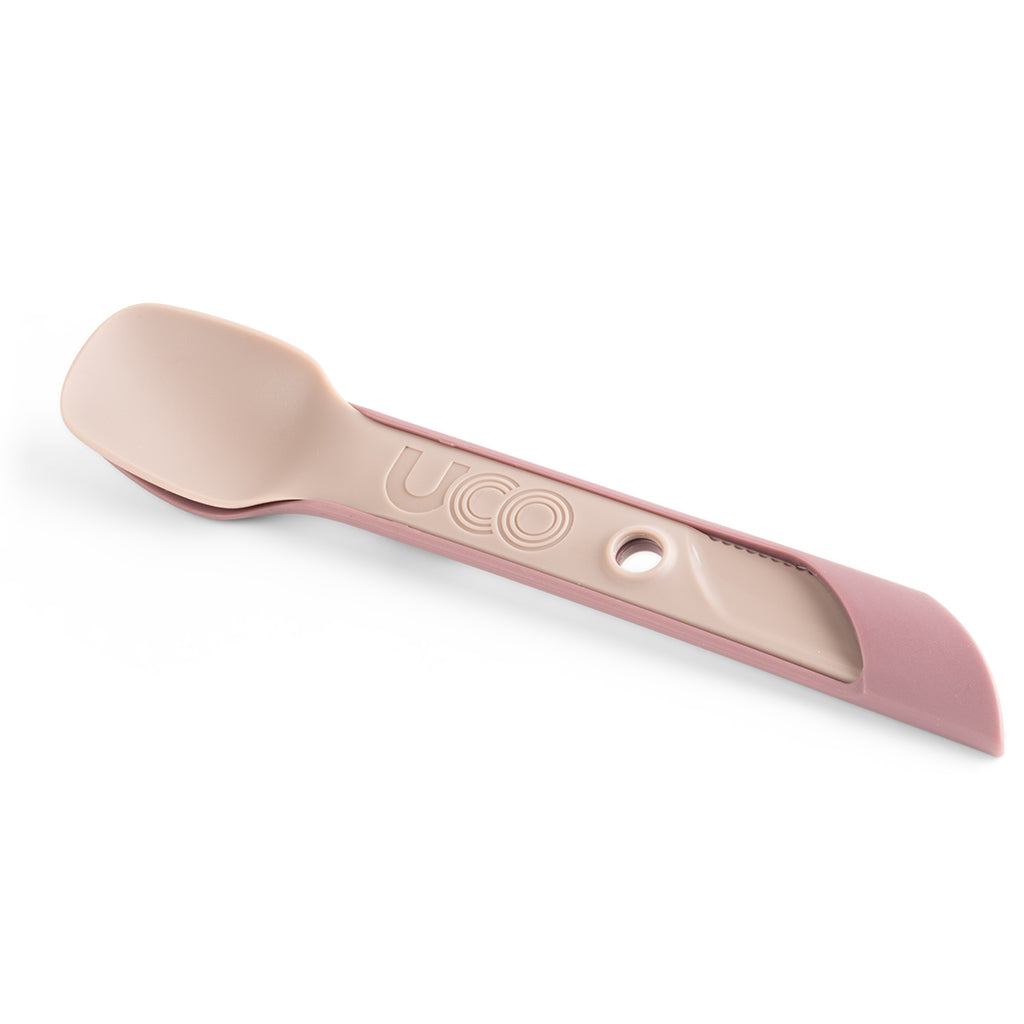 Pale pink UCO Switch Spork shown extended in long-handled mode