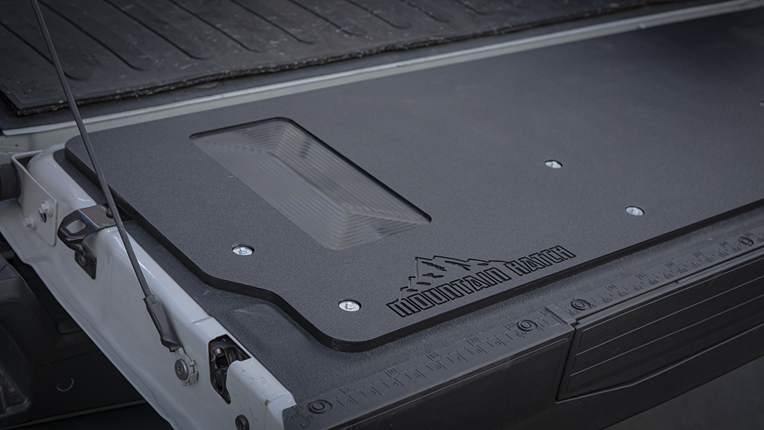 Close-up of the recessed tray, mounting screws and logo on the Mountain Hatch 2023+ Super Duty panel