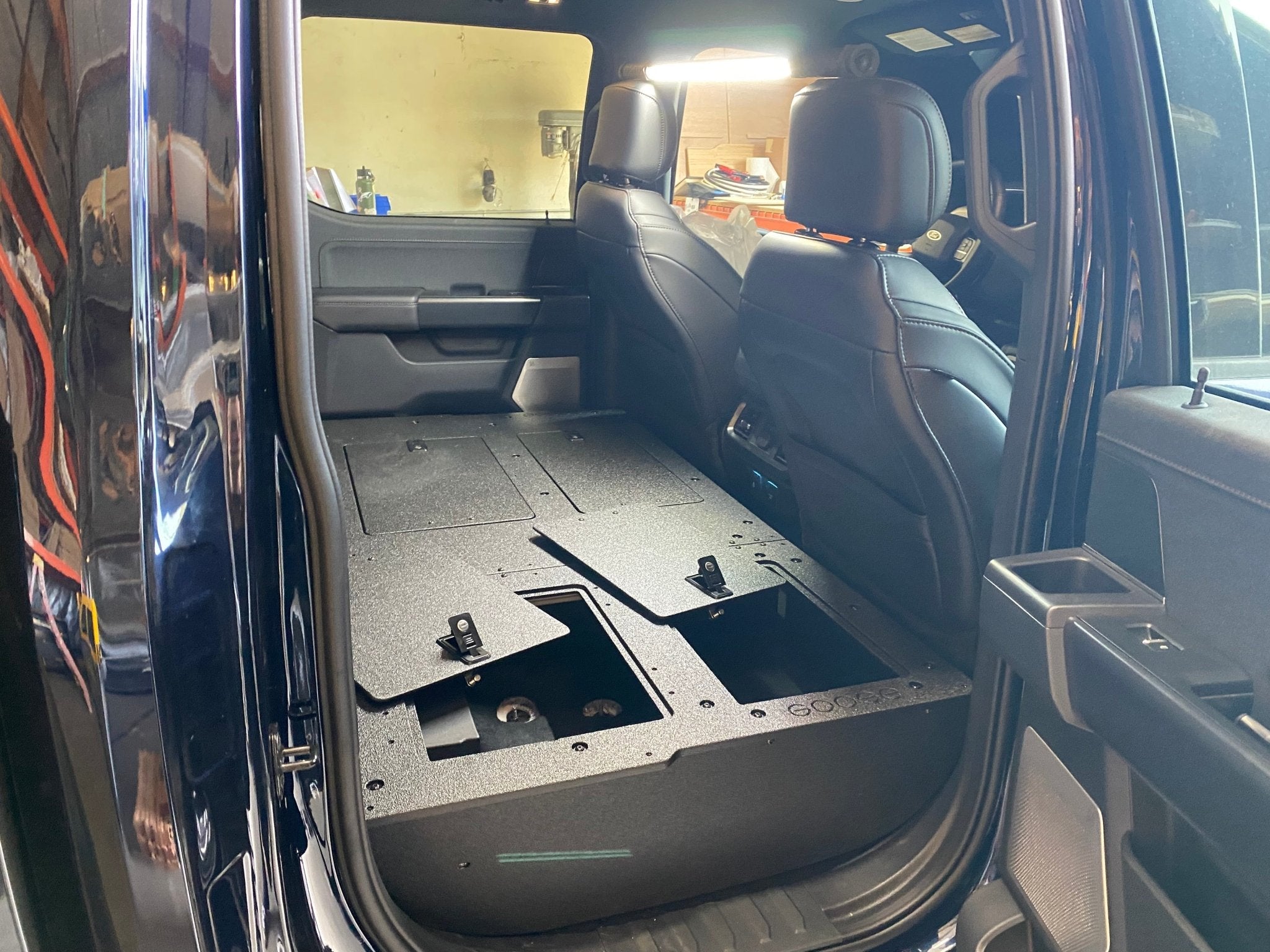 Ford - F150 2021-Present - 14th Gen. SuperCrew - Second Row Seat Delete Plate System with Factory B&O Subwoofer Center Wall with Exterior Port Seat Delete Plate System Goose Gear- Overland Kitted