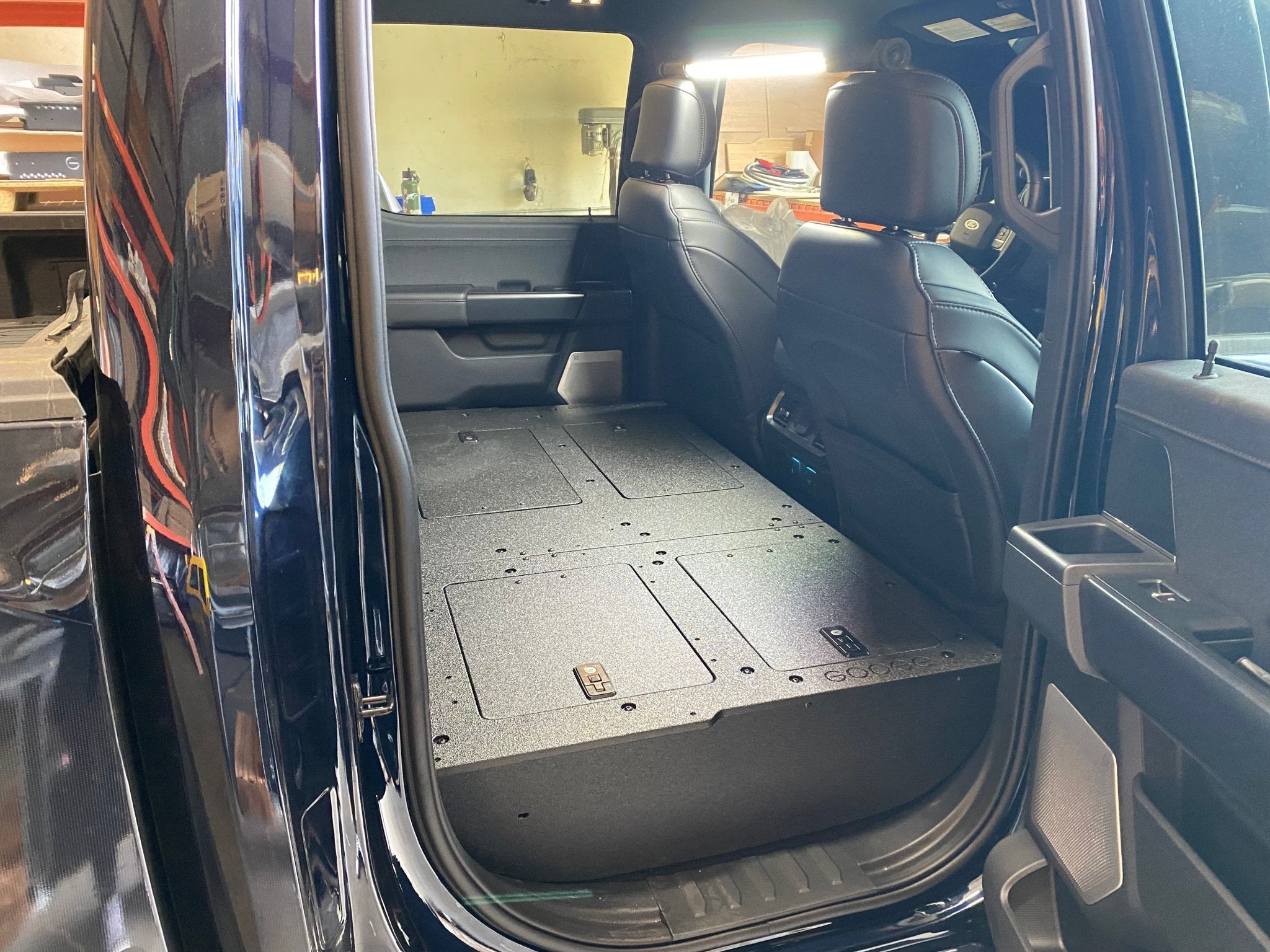 Ford - F150 2021-Present - 14th Gen. SuperCrew - Second Row Seat Delete Plate System with Factory B&O Subwoofer Center Wall with Exterior Port Seat Delete Plate System Goose Gear- Overland Kitted