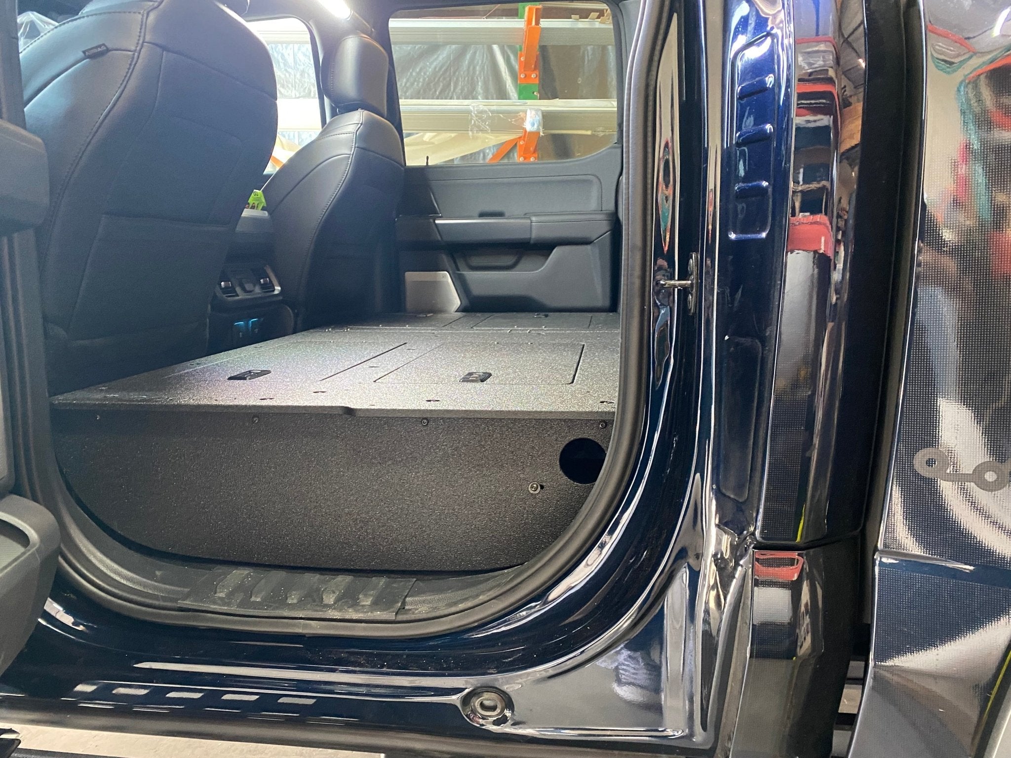 Ford - F150 2021-Present - 14th Gen. SuperCrew - Second Row Seat Delete Plate System with Factory B&O Subwoofer Center Wall with Exterior Port Seat Delete Plate System Goose Gear- Overland Kitted