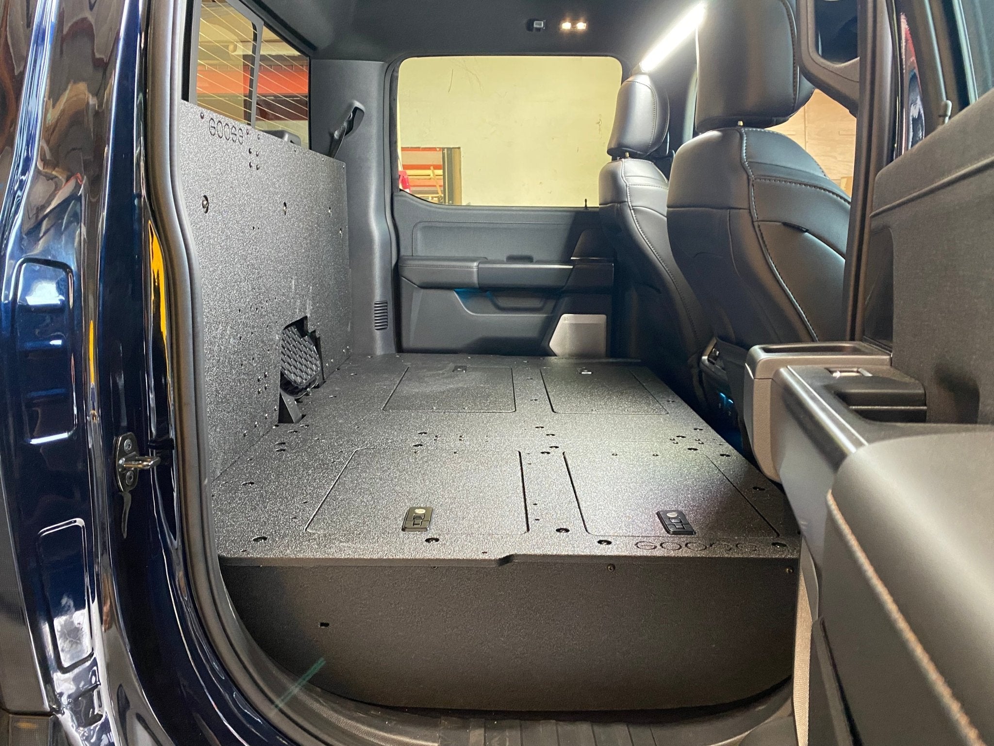 Ford - F150 2021-Present - 14th Gen. SuperCrew - Second Row Seat Delete Plate System with Factory B&O Subwoofer Center Wall with Exterior Port Seat Delete Plate System Goose Gear- Overland Kitted