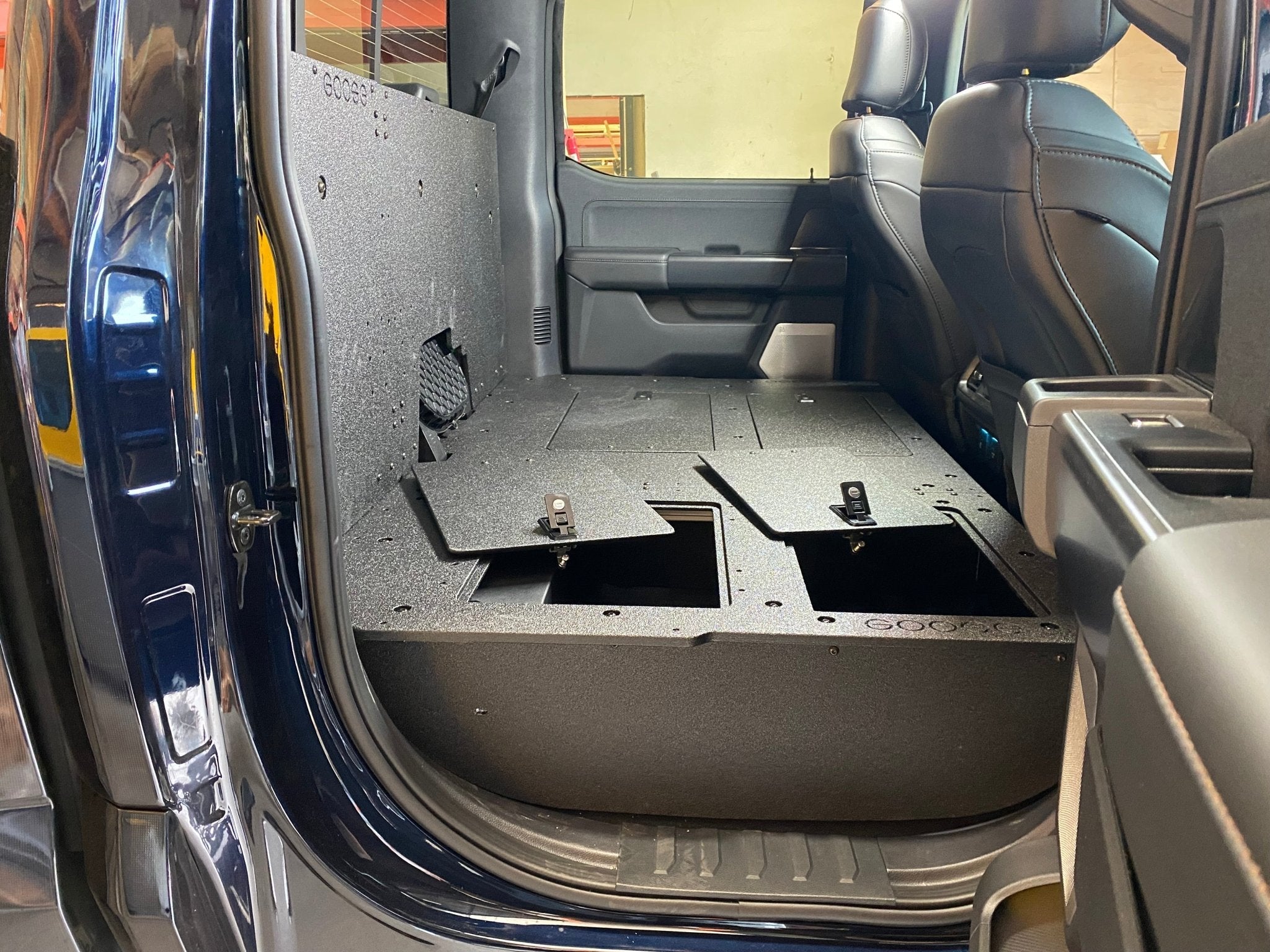 Ford - F150 2021-Present - 14th Gen. SuperCrew - Second Row Seat Delete Plate System with Factory B&O Subwoofer Center Wall with Exterior Port Seat Delete Plate System Goose Gear- Overland Kitted