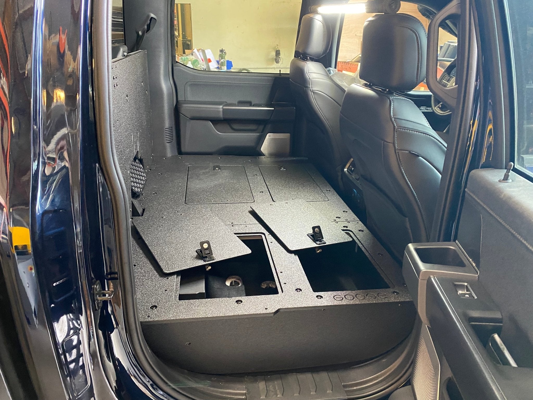 Ford - F150 2021-Present - 14th Gen. SuperCrew - Second Row Seat Delete Plate System with Factory B&O Subwoofer Center Wall with Exterior Port Seat Delete Plate System Goose Gear- Overland Kitted