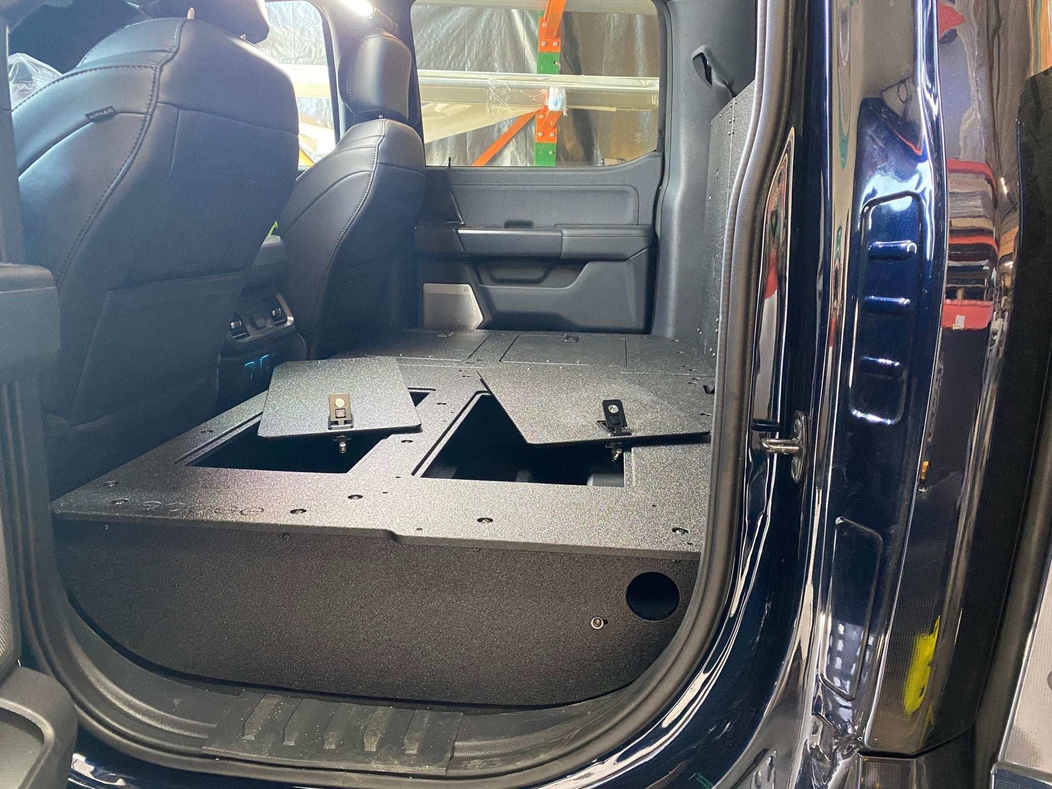 Ford - F150 2021-Present - 14th Gen. SuperCrew - Second Row Seat Delete Plate System with Factory B&O Subwoofer Center Wall with Exterior Port Seat Delete Plate System Goose Gear- Overland Kitted