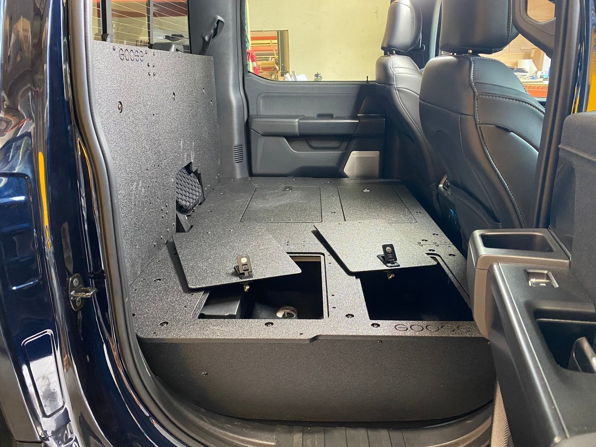 Ford - F150 2021-Present - 14th Gen. SuperCrew - Second Row Seat Delete Plate System with Factory B&O Subwoofer Center Wall with Exterior Port Seat Delete Plate System Goose Gear- Overland Kitted