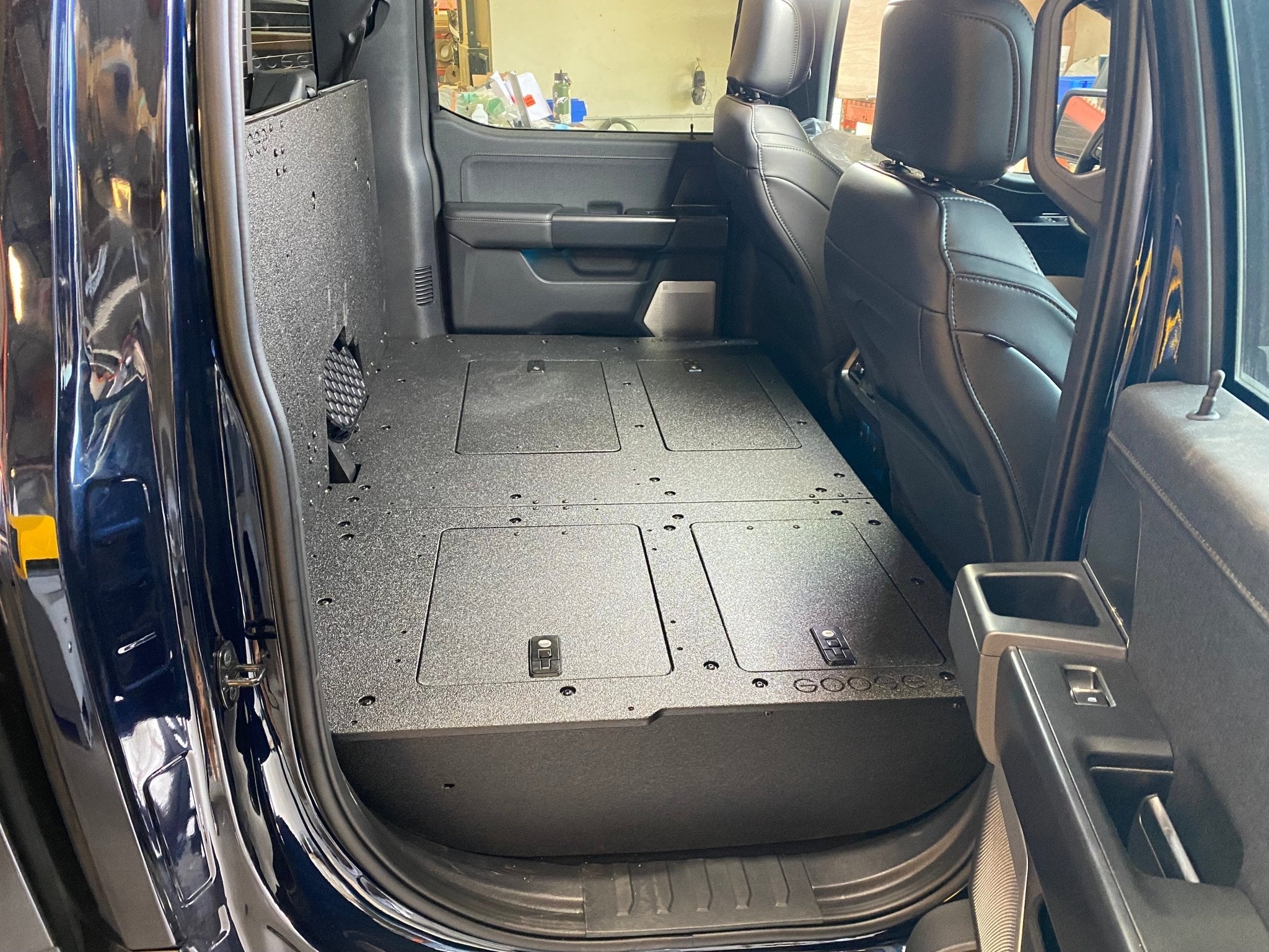Ford - F150 2021-Present - 14th Gen. SuperCrew - Second Row Seat Delete Plate System with Factory B&O Subwoofer Center Wall with Exterior Port Seat Delete Plate System Goose Gear- Overland Kitted