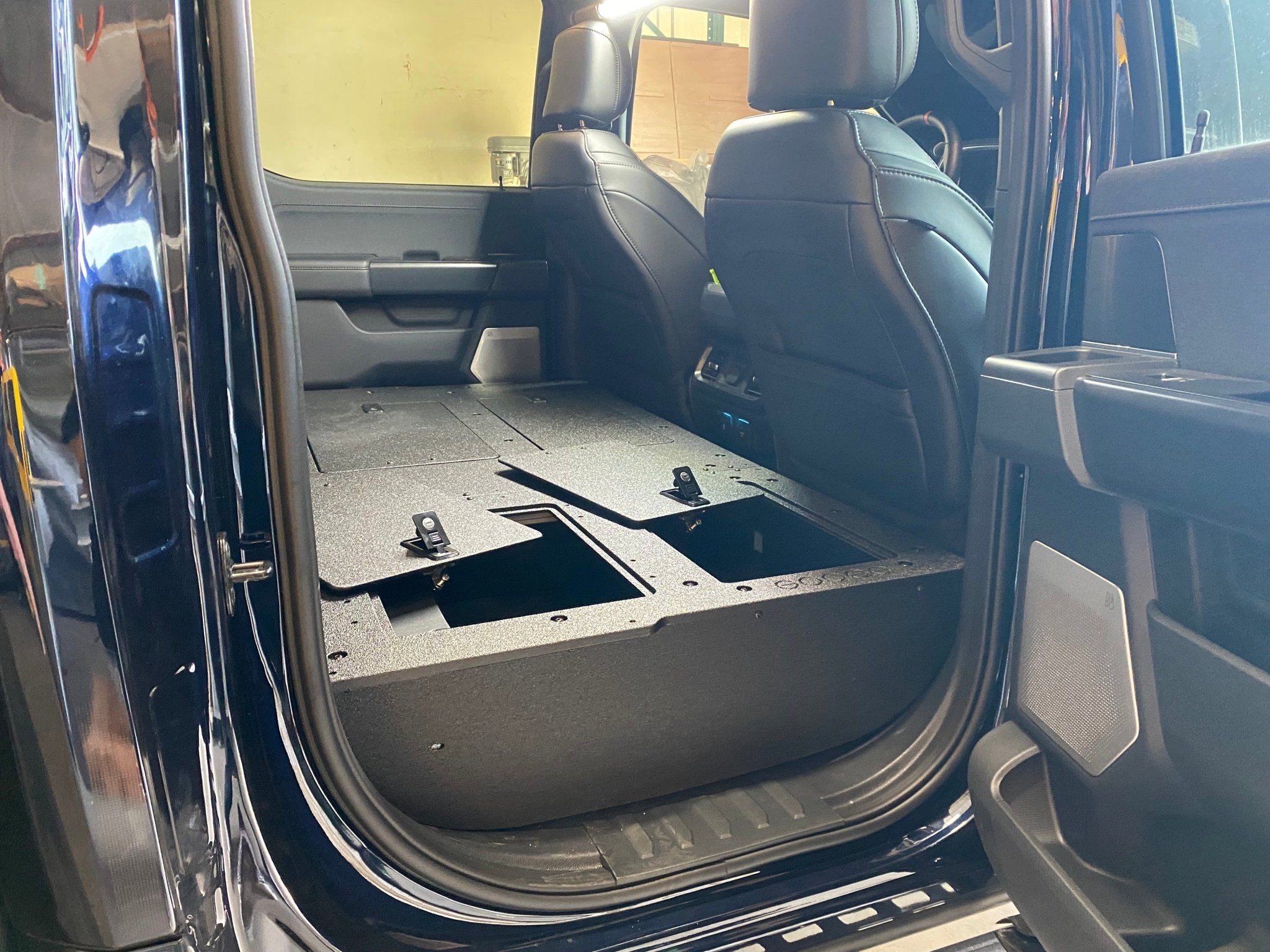 Ford - F150 2021-Present - 14th Gen. SuperCrew - Second Row Seat Delete Plate System with Factory B&O Subwoofer Center Wall with Exterior Port Seat Delete Plate System Goose Gear- Overland Kitted