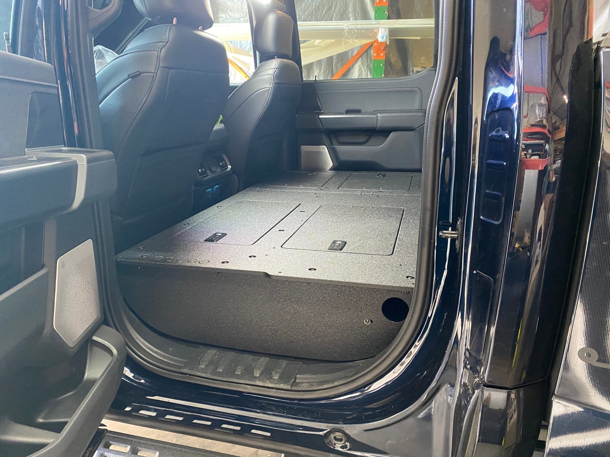 Ford - F150 2021-Present - 14th Gen. SuperCrew - Second Row Seat Delete Plate System with Factory B&O Subwoofer Center Wall with Exterior Port Seat Delete Plate System Goose Gear- Overland Kitted