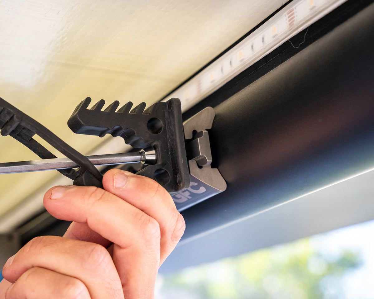 Screwdriver set into a bracket on camper L-track