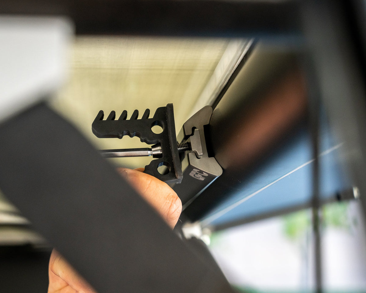 Tool holder bracket fixed to camper L-track with a track nut