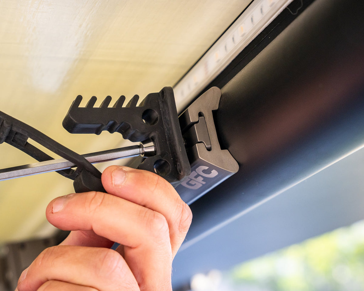 Tool holder bracket bolted to L-track with an L-track nut