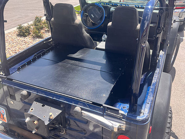 Ridgeback top panels in a blue TJ seen from the rear corner